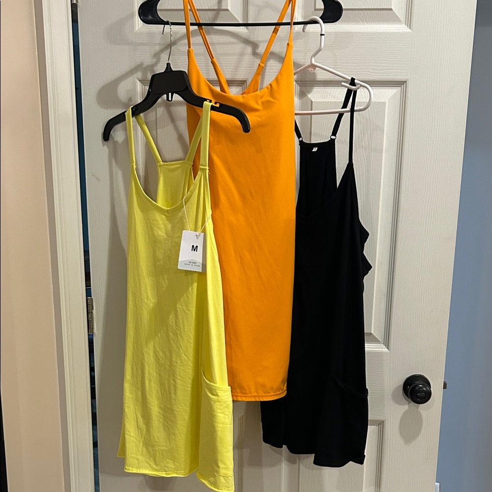 Three-Pack Sleeveless Tank Dresses - Yellow, Orange, Black. Built-in shorts